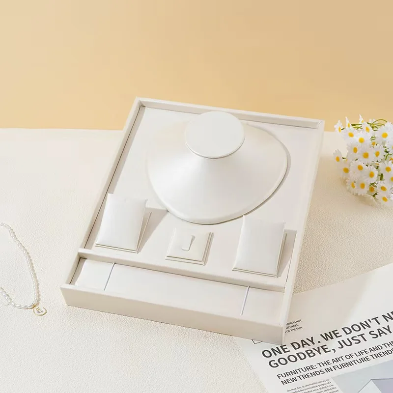White jewelry presentation box with necklace and earring inserts